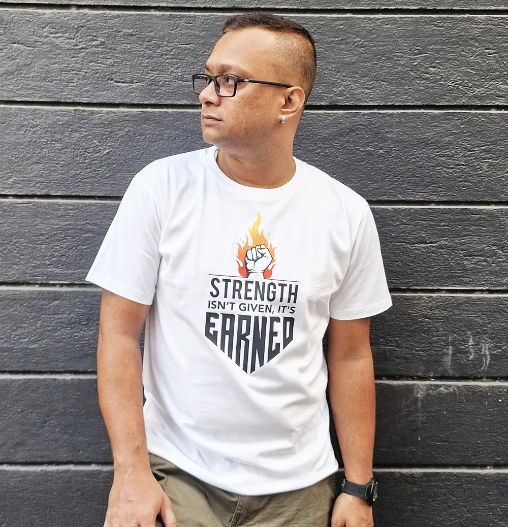 STRENGTH ISN'T GIVEN, IT'S EARNED Unisex T-Shirt for Boys