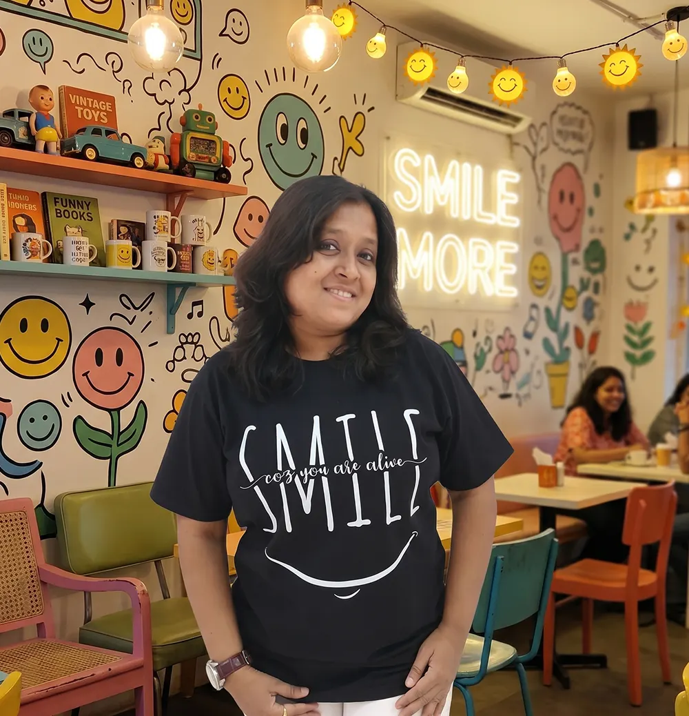 Woman wearing Smile coz you are alive t-shirt