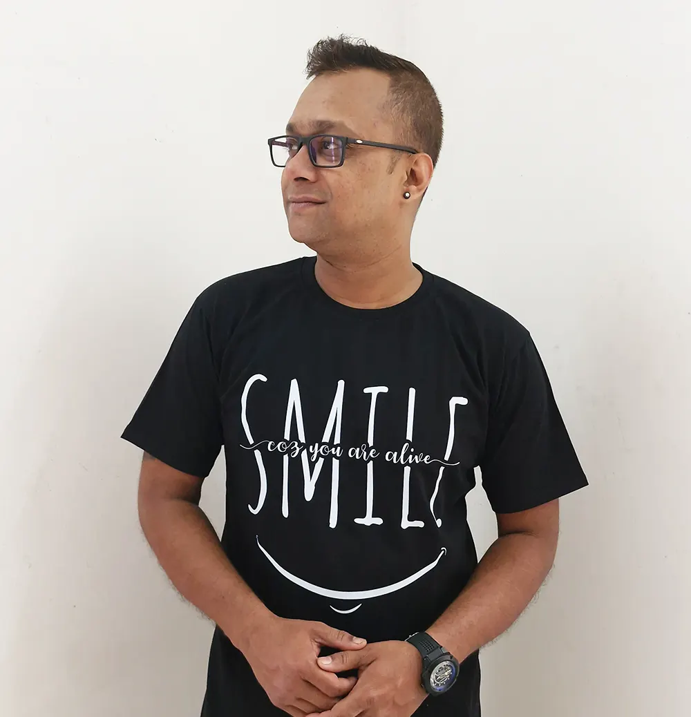 Man wearing Smile coz you are alive t-shirt